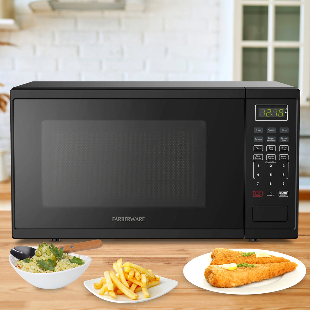 Farberware Countertop Microwave Ov 1100 Watts. 2.2 cu ft - Smart Sensor With LED Lighting and Child Lock - Perfect for Apartments and Dorms - Easy Clean Black Interior. Stainless Steel