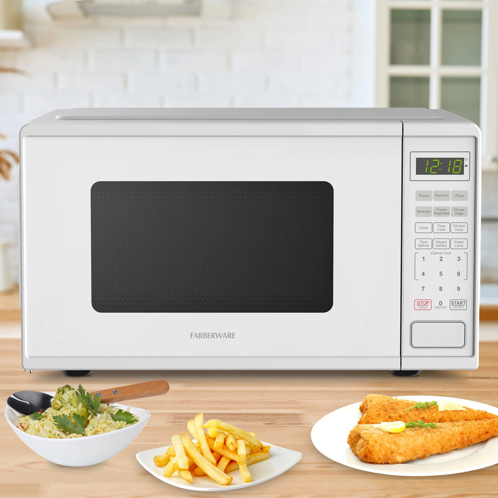 Farberware Countertop Microwave Ov 1100 Watts. 2.2 cu ft - Smart Sensor With LED Lighting and Child Lock - Perfect for Apartments and Dorms - Easy Clean Black Interior. Stainless Steel