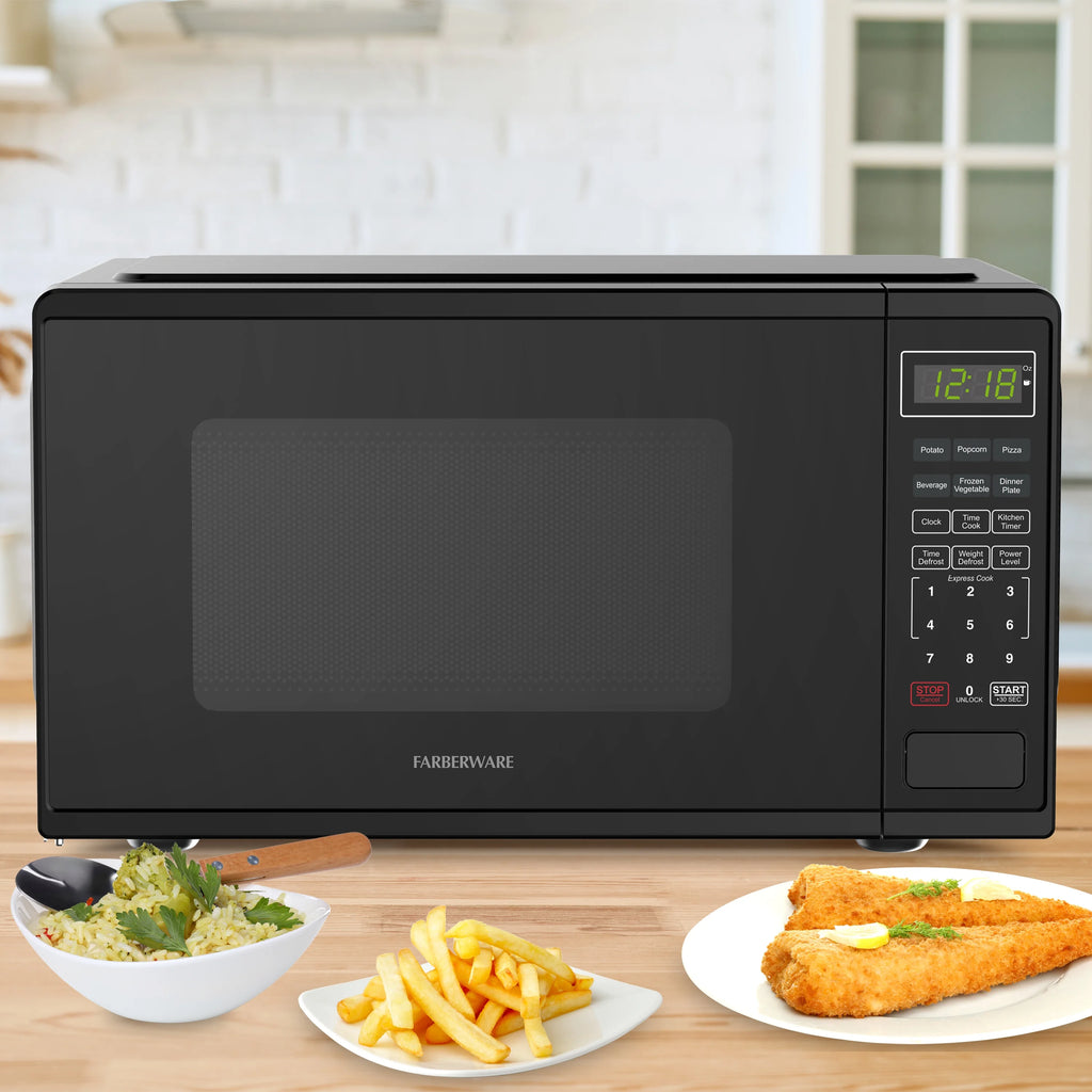 Farberware Countertop Microwave Ov 1100 Watts. 2.2 cu ft - Smart Sensor With LED Lighting and Child Lock - Perfect for Apartments and Dorms - Easy Clean Black Interior. Stainless Steel