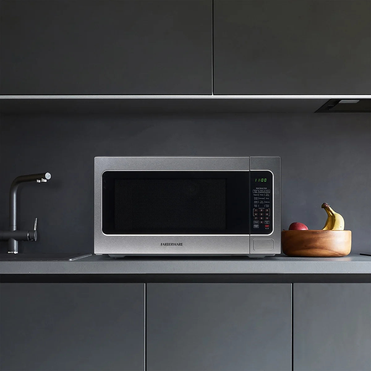 Farberware Countertop Microwave Ov 1100 Watts. 2.2 cu ft - Smart Sensor With LED Lighting and Child Lock - Perfect for Apartments and Dorms - Easy Clean Black Interior. Stainless Steel